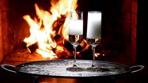 Two glasses of champagne with flame on background Stock Footage 62856685