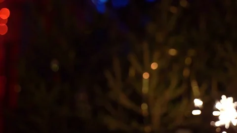 Two glasses of champagne hit each other, Clebration, sparklers shine in hands. Stock Footage 122774837