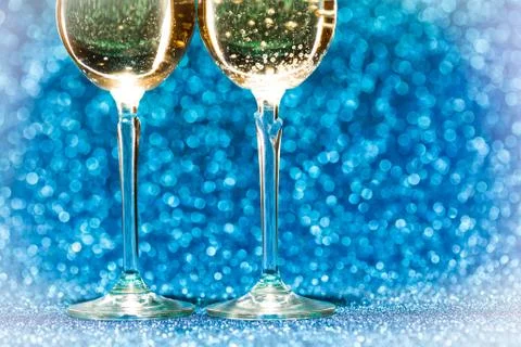 Two glasses of champagne with lights in the background Stock-Fotos