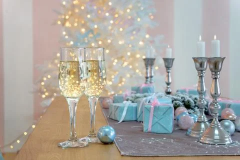 Two glasses of champagne surrounded by luxury Christmas New year background a Stock Photos