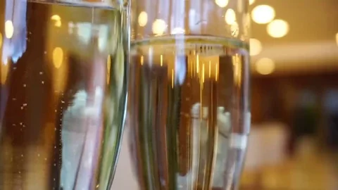 Two glasses of champagne waiting to be served by guests Stock-Footage 69201526