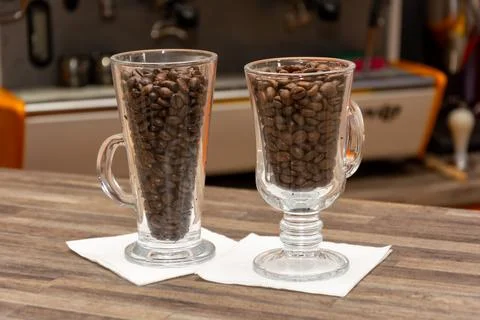 Two glasses with coffee beans Stock Photos