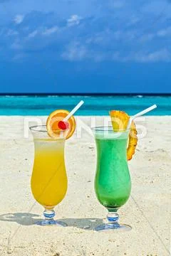 Two Glasses Of Cool Drink Are On The Beach, Maldives, The Indian Ocean