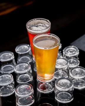 Two glasses of craft beer creatively presented at the bar Stock Photos