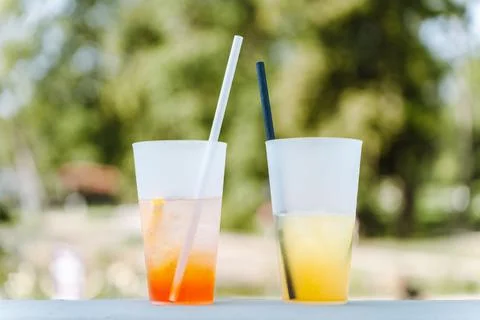 Two glasses with different summer refreshing cocktails on the table of a summer Stock Photos