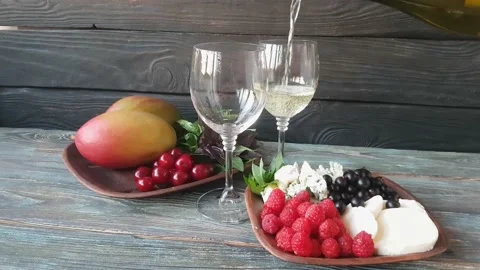 Two glasses filled with dry white wine. Wood background Stock Footage 156861681