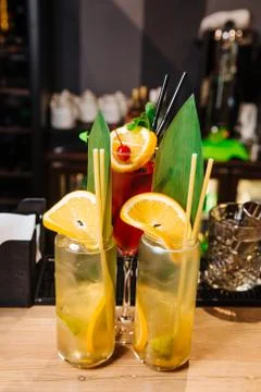 Two glasses of fresh soft drinks from orange and lemon. Stock Photos