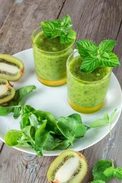Two glasses of fruit and vegetable smoothies Stock Photos