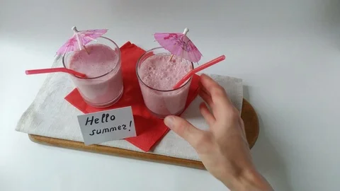 Two glasses fruit smoothies milkshake taking away Stock Footage 109499874