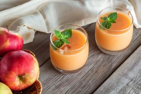 Two glasses of fruit smoothies Stock Photos