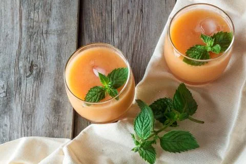 Two glasses of fruit smoothies Stock Photos