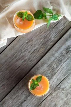 Two glasses of fruit smoothies Stock Photos