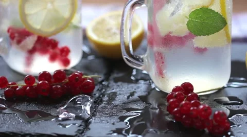 Two glasses of homemade lemonade, refreshing summer detox drink made of lemon Stock-Footage 66377734