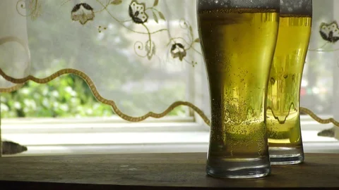 Two glasses of lager beer Stockbeeldmateriaal 91623252