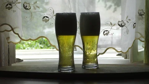 Two glasses of lager beer Stock Footage 91623546