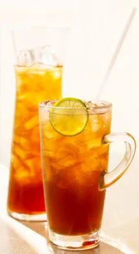 Two glasses of lemon ice tea on the table Stock Photos