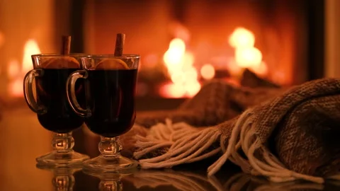 Two glasses with mulled wine and plaid on the fireplace background. Stock Footage 166395420