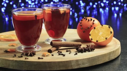 Two glasses of mulled wine close-up with apple orange and cinnamon Video stock 145829903
