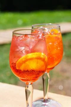 Two glasses or refreshing orange spritz cocktails with ice and citrus slice.. Stock-Fotos