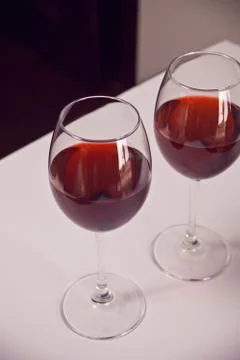 Two glasses with red grape wine. Romantic dinner concept. Stock Photos