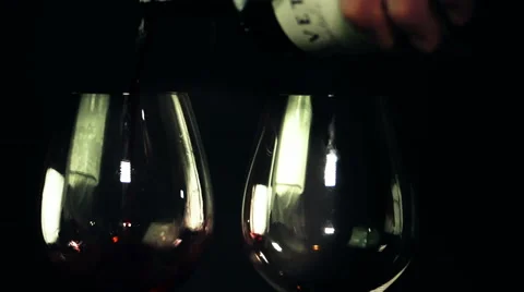 Two glasses of red wine being poured. Stock Footage 62500320