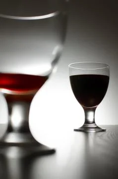 Two glasses of red wine isolated on background. Stock Photos