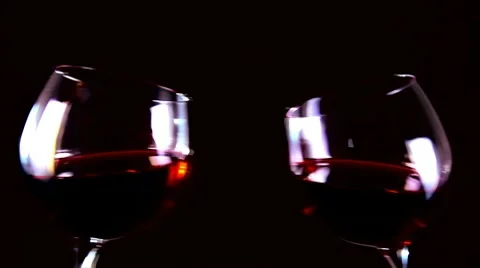 Two glasses of red wine. Toast! Cheers! slow motion Stock Footage