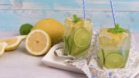 Two glasses of refreshing lemon and lime infused water Stock Photos
