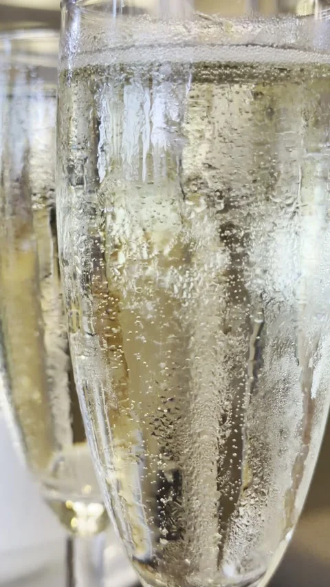 Two Glasses of Sparkling Champagne with Bubbles Close Up Stock Footage 339207070