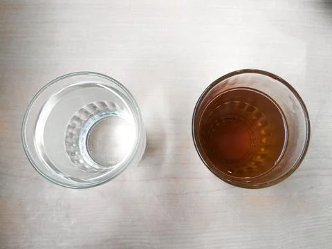 Two Glasses Of Water On The Table Stock Photos