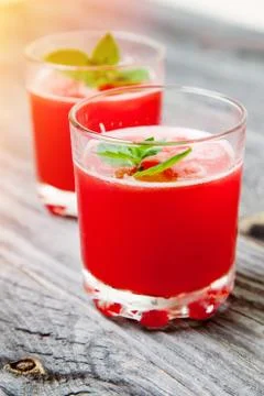 Two glasses of watermelon smoothie on rustic backround Stock Photos