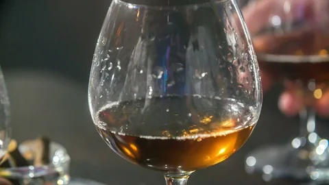 Two glasses of whisky on a table Stock Footage 112198241