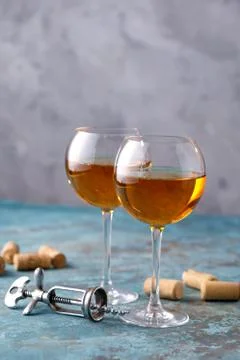 Two glasses with white wine on a textural background. Copy space. Place for y Stock Photos