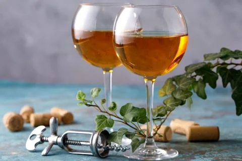 Two glasses with white wine on a textural background. Copy space. Place for y Stock Photos