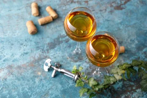 Two glasses with white wine on a textural background. Copy space. Place for y Stock Photos