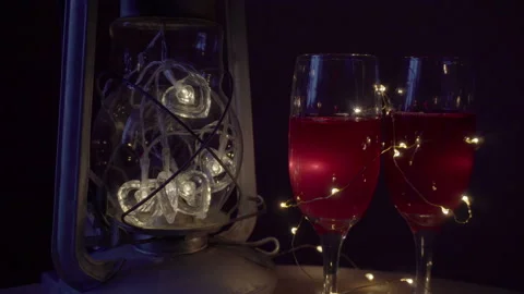 Two glasses of wine and an old lantern 4K Video stock 85689898