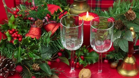 Two glasses of wine being poured at christmas Stock Footage 69949677
