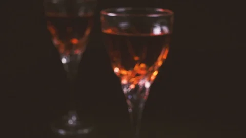 Two glasses of wine on a black background Video stock 87468300