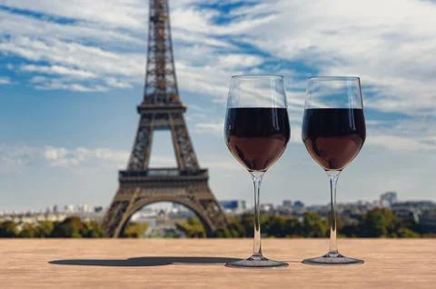 Two glasses of wine on Eiffel tower and Paris skyline background. 写真素材
