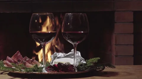 Two glasses of wine on fire background, dolly shot Stock Footage 142208410