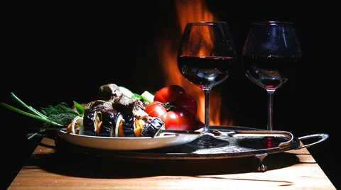 Two glasses of wine with flame on background Stock Footage 62929373