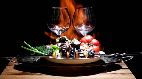 Two glasses of wine with flame on background Stock Footage 62929720