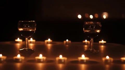 Two glasses with wine on table with candles Stock Footage 159548795