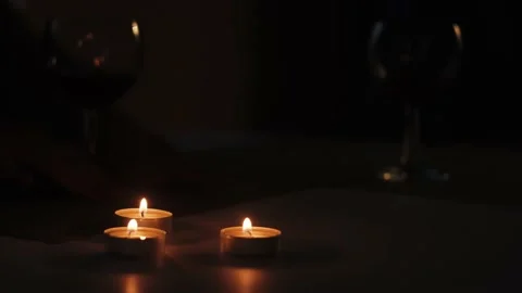 Two glasses with wine on table with candles Stock Footage 159550257