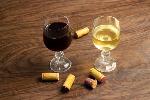 Two glasses of wine on the table, red wine and white wine Stock Photos