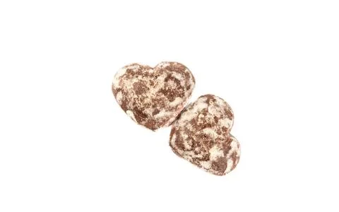 Two glazed gingerbread in the shape of a heart isolated on a white background Foto stock