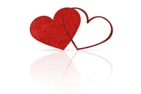 Two glittering red hearts on a white glossy background. Valentine's Day Stock Photos