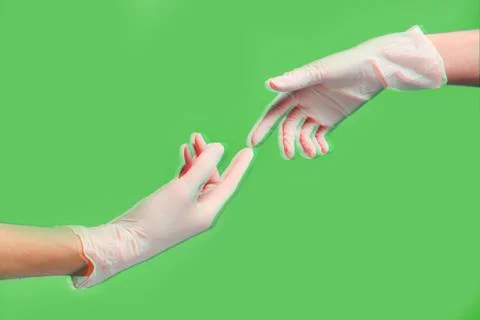 Two gloved hands touch each other during pandemic coronavirus quarantine on a Stock Photos