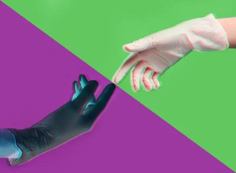 Two gloved hands touch each other during pandemic coronavirus quarantine on a Stock Photos