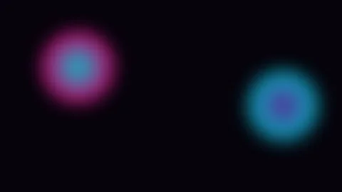Two glowing ethereal orbs of blue and purple light on a dark background Video stock 336263505